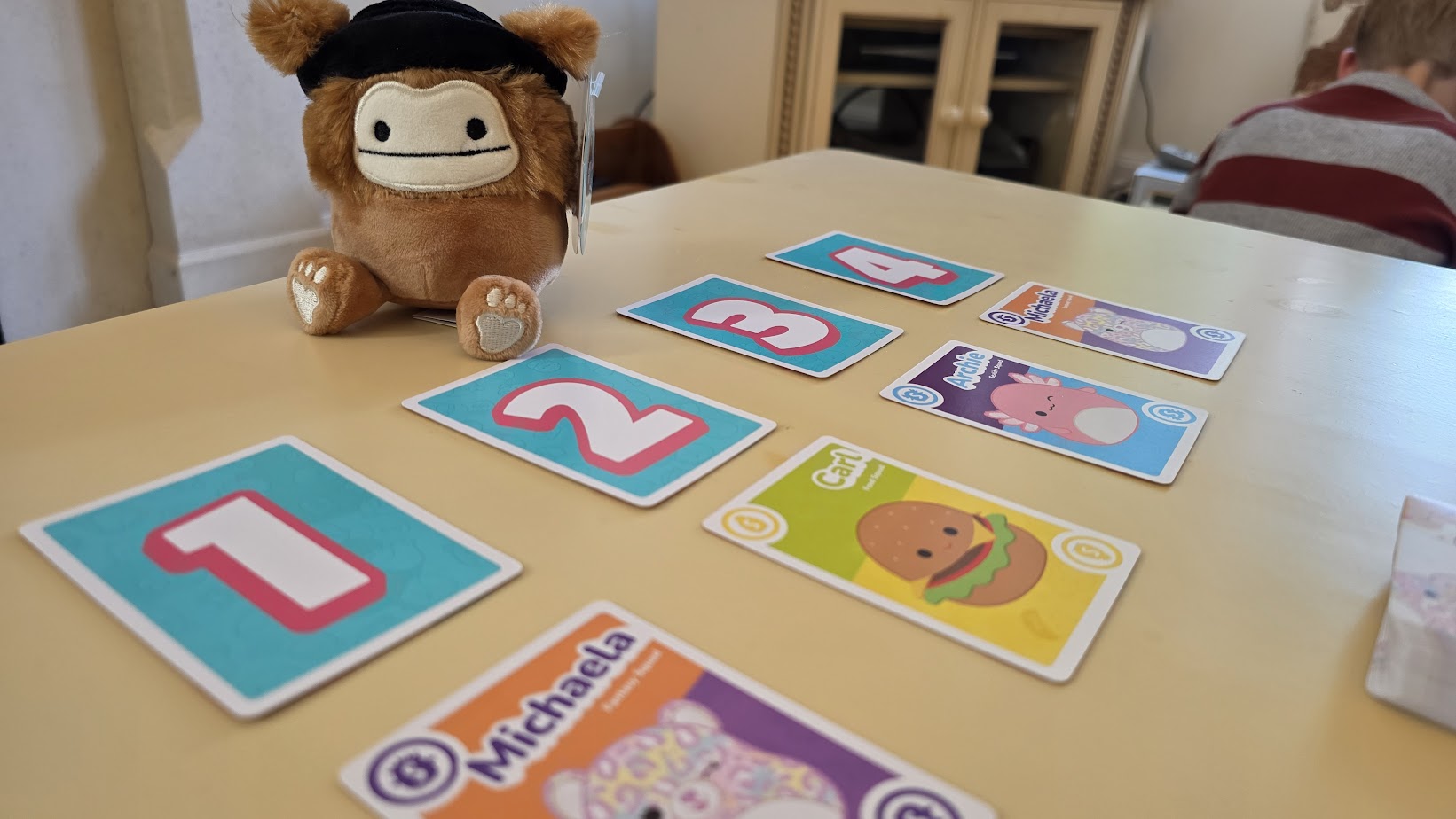 May be an image of 1 person, toy and text