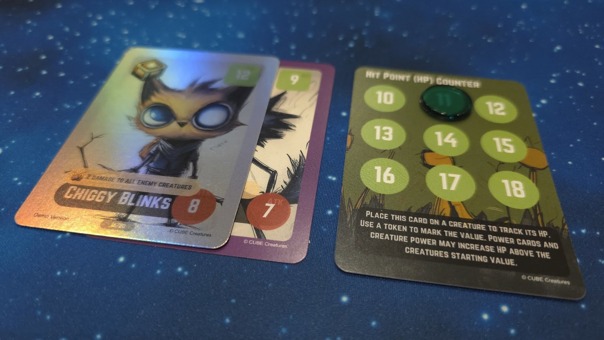 May be an image of text that says "RtTPOINT(HPGOUNTER HIT POINT (HP) COUNTER 10 12 13 PEAMAGE T-ALL CHIGGYBLINKS CHIGGY CHIGEYBLINKS BL INKS Damy Vbrstian P 14 15 16 17 CLIBE Creaturos 18 PLACE THIS CARD ON CREATURE to TRACK USE TOKEN CREATURE POWER MARK E VALUE. POWER CARDS AND Hp CREATURES MAY INCREASE STARTING NALUE ABOVE E CURE Greatures"